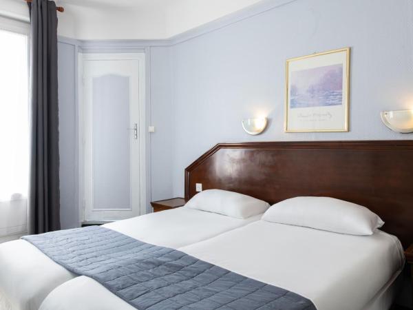 Hôtel Ambassadeur : photo 2 de la chambre chambre lits jumeaux