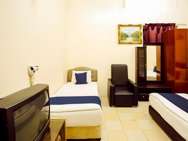 New Casavilla Travellers Lodge Pudu : photo 2 de la chambre chambre triple standard