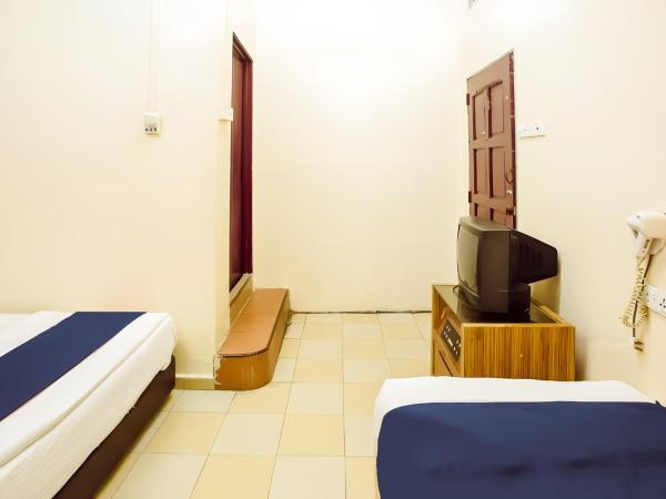 New Casavilla Travellers Lodge Pudu : photo 3 de la chambre chambre triple standard
