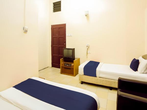 New Casavilla Travellers Lodge Pudu : photo 7 de la chambre chambre triple standard