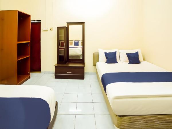 New Casavilla Travellers Lodge Pudu : photo 2 de la chambre chambre familiale