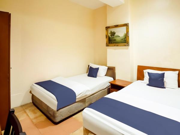 New Casavilla Travellers Lodge Pudu : photo 2 de la chambre chambre lits jumeaux