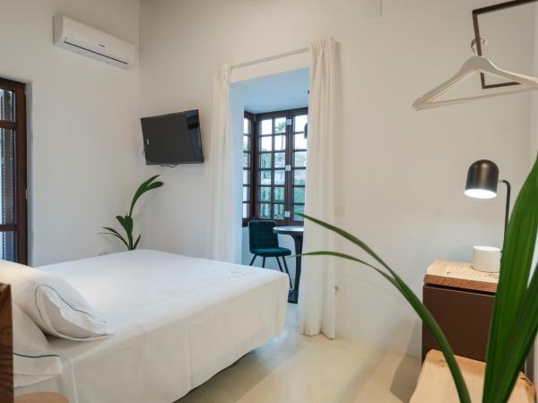 La Moderna Suites : photo 1 de la chambre suite lit king-size avec balcon