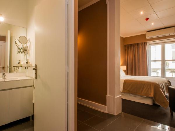 PH Downtown Suites : photo 1 de la chambre suite avec balcon