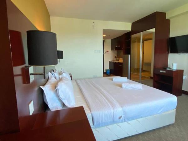 COZY Studio at Ming Garden Residence : photo 1 de la chambre studio lit king-size