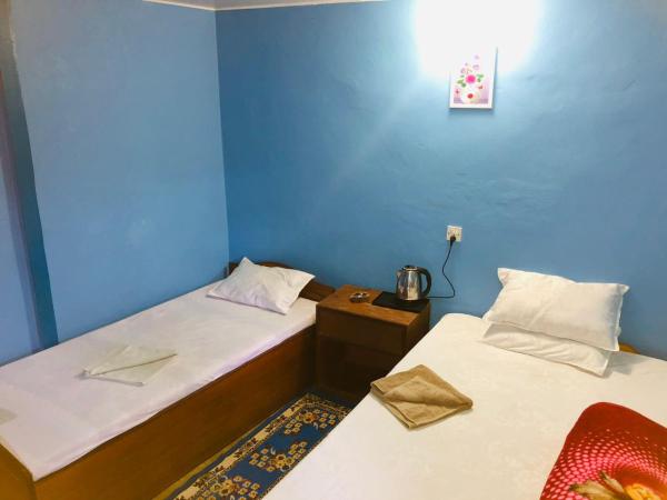 Goodday Backpackers : photo 4 de la chambre chambre double ou lits jumeaux - vue sur jardin