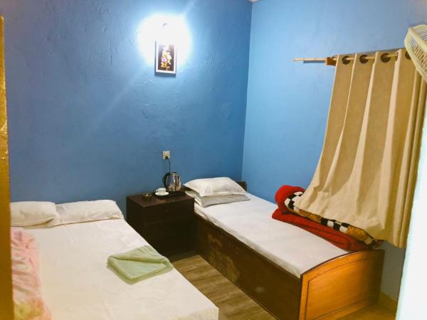 Goodday Backpackers : photo 3 de la chambre chambre double ou lits jumeaux - vue sur jardin