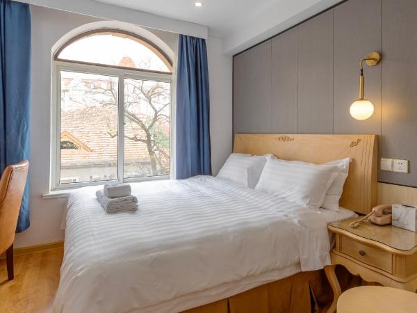 Qingdao Liuying Jieli Hotel - Qingdao Station Trestle Bridge Branch : photo 3 de la chambre chambre lit queen-size deluxe