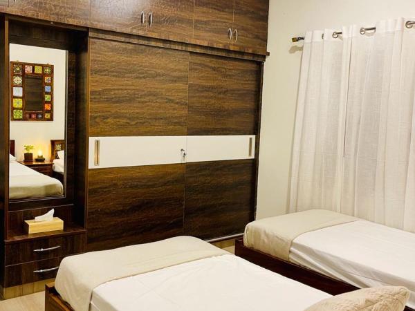 Vasudha : photo 10 de la chambre chambre double ou lits jumeaux avec salle de bains privative