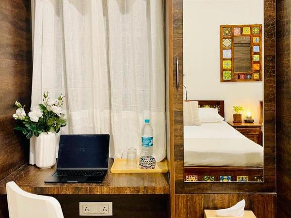 Vasudha : photo 9 de la chambre chambre double ou lits jumeaux avec salle de bains privative