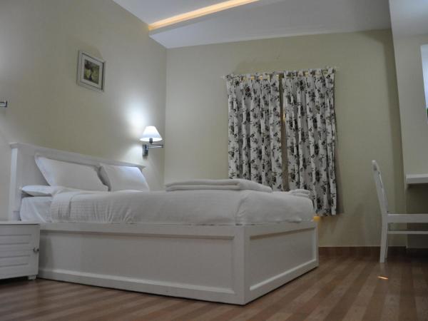 Daffodils Spice Court : photo 1 de la chambre chambre supérieure lit queen-size