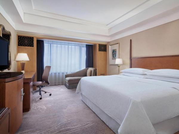 Sheraton Xi'an Hotel : photo 1 de la chambre chambre lit king-size deluxe - vue sur ville