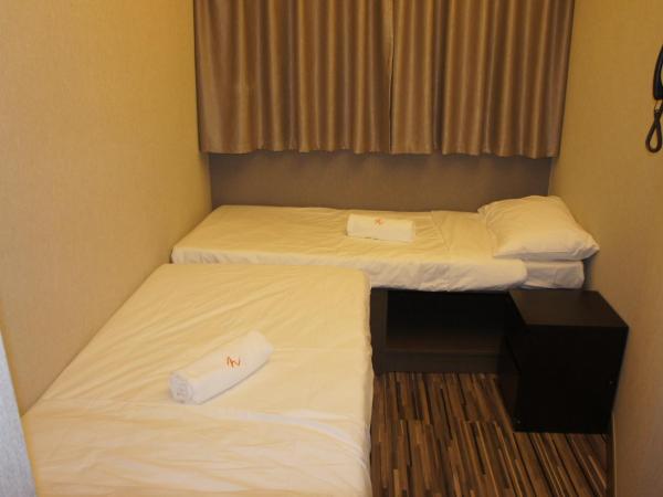 Homy Inn North Point : photo 3 de la chambre chambre lits jumeaux standard