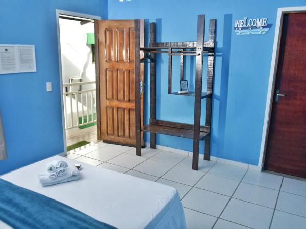 Pousada Jardim Magico : photo 3 de la chambre chambre quadruple avec salle de bains privative