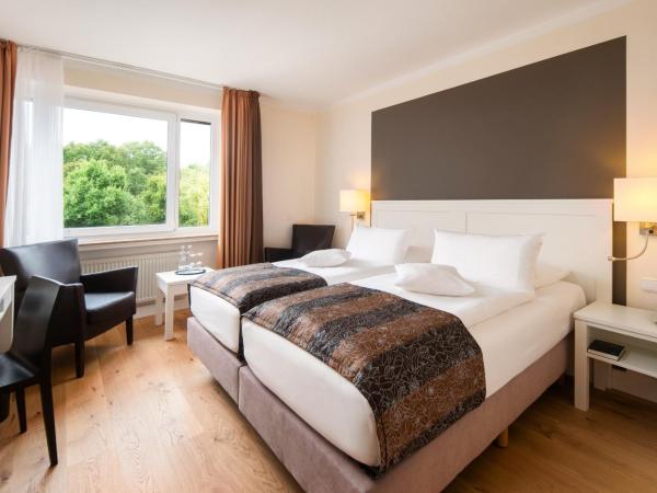 Hotel Munte am Stadtwald : photo 1 de la chambre chambre double standard