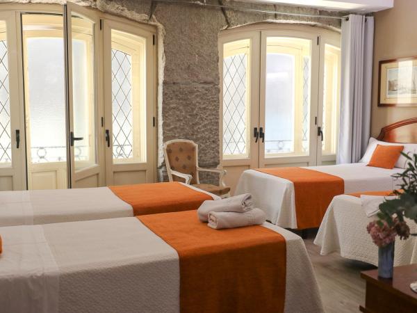 Hostal San Lorenzo : photo 8 de la chambre chambre quadruple (4 adultes)