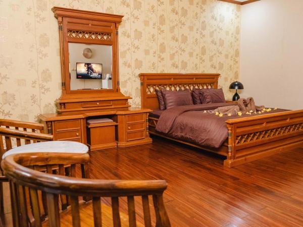 Escotel Keraton By Reccoma : photo 4 de la chambre suite deluxe avec lit king-size