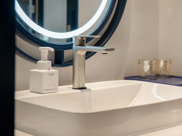 广州番禺万博中心舒与酒店 : photo 1 de la chambre chambre lit queen-size