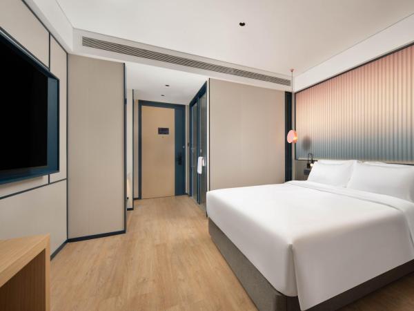 广州番禺万博中心舒与酒店 : photo 2 de la chambre chambre lit queen-size