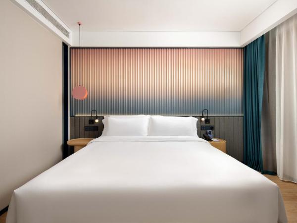 广州番禺万博中心舒与酒店 : photo 3 de la chambre chambre lit queen-size