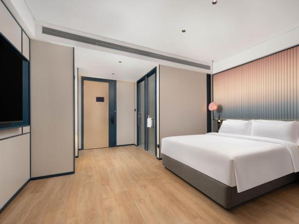 广州番禺万博中心舒与酒店 : photo 1 de la chambre chambre lit queen-size