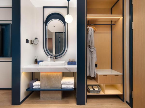 广州番禺万博中心舒与酒店 : photo 5 de la chambre chambre lit queen-size