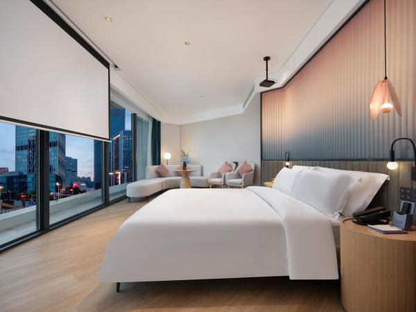 广州番禺万博中心舒与酒店 : photo 4 de la chambre studio avec baignoire spa