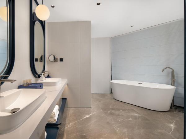 广州番禺万博中心舒与酒店 : photo 3 de la chambre studio avec baignoire spa