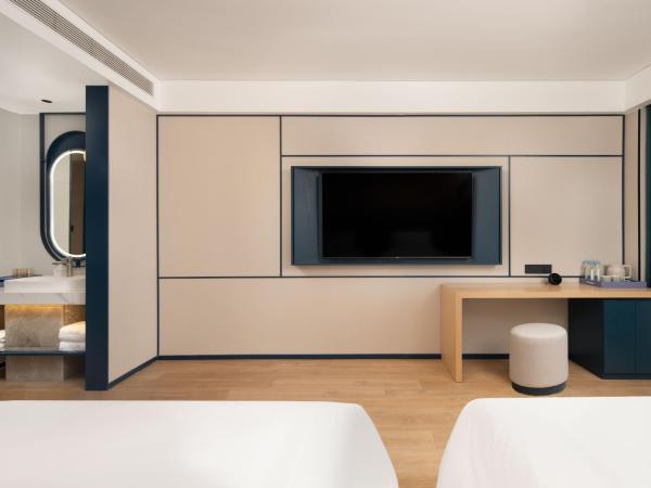 广州番禺万博中心舒与酒店 : photo 3 de la chambre chambre lits jumeaux spacieuse