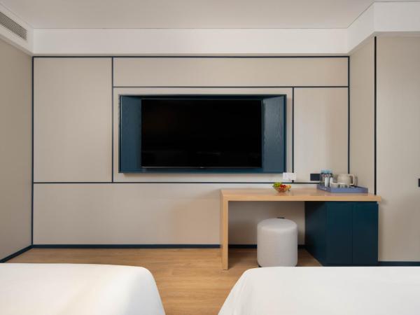 广州番禺万博中心舒与酒店 : photo 3 de la chambre chambre deluxe double ou lits jumeaux