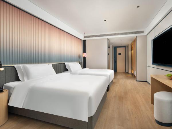 广州番禺万博中心舒与酒店 : photo 5 de la chambre chambre deluxe double ou lits jumeaux