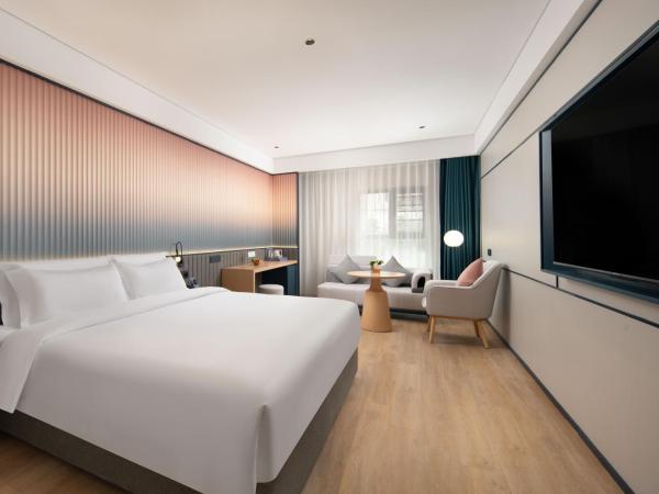 广州番禺万博中心舒与酒店 : photo 2 de la chambre chambre lit queen-size