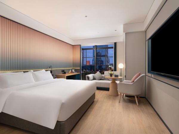 广州番禺万博中心舒与酒店 : photo 1 de la chambre chambre lit queen-size deluxe