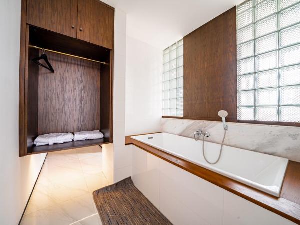 Wuyu Hotel - Chongqing Jiangbei Airport : photo 10 de la chambre chambre lits jumeaux avec baignoire