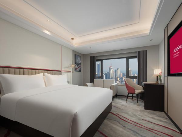 Mövenpick by Accor Binjiang Nanjing : photo 1 de la chambre chambre lit king-size deluxe