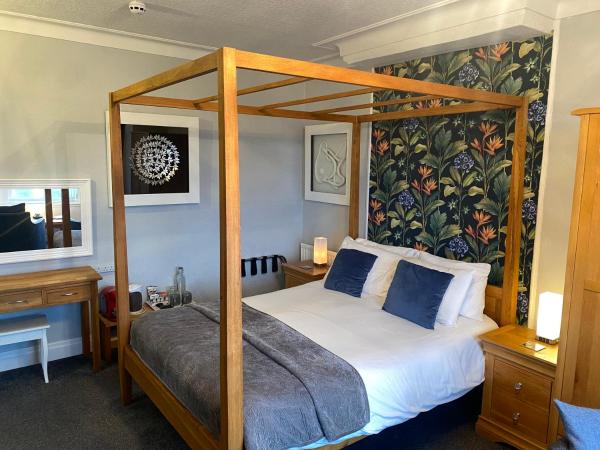 The Fossil Tree Hotel : photo 3 de la chambre chambre double de luxe avec lit à baldaquin - vue sur mer