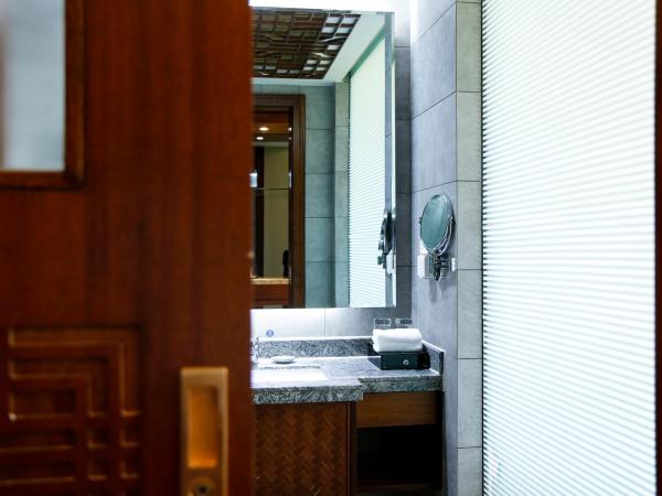 Luhuitou State Guesthouse & Resort : photo 2 de la chambre chambre lit king-size deluxe - vue sur jardin