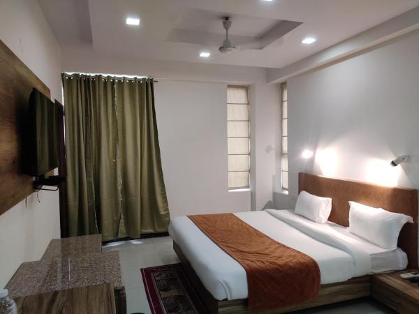 Pacific Inn Green, Gurgaon : photo 7 de la chambre chambre lit king-size deluxe