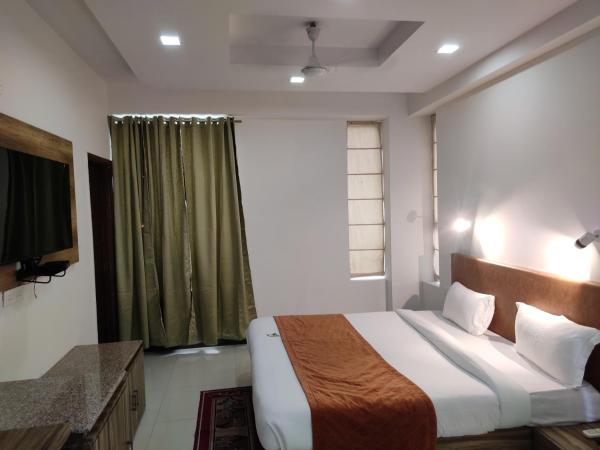 Pacific Inn Green, Gurgaon : photo 9 de la chambre chambre lit king-size deluxe