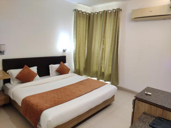 Pacific Inn Green, Gurgaon : photo 7 de la chambre chambre lit king-size