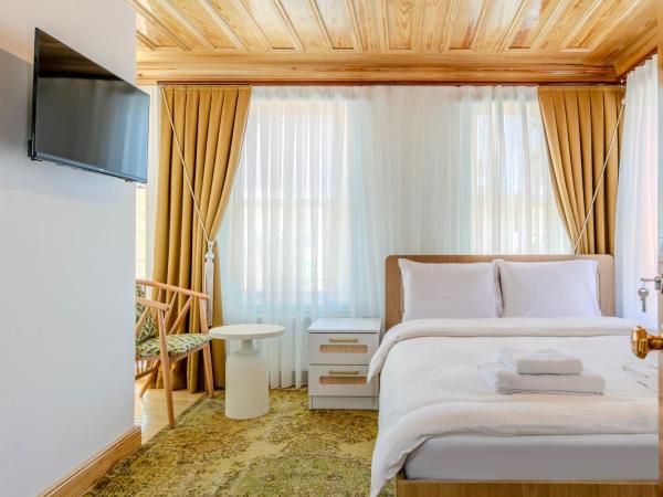 Evra Suites Hotel : photo 3 de la chambre chambre lit king-size avec balcon