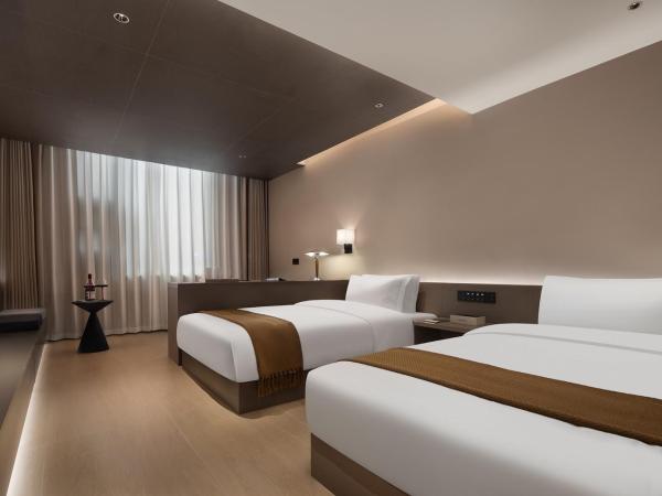 Guanran Hotel - Yongningmen Subway Station : photo 2 de la chambre chambre lits jumeaux deluxe