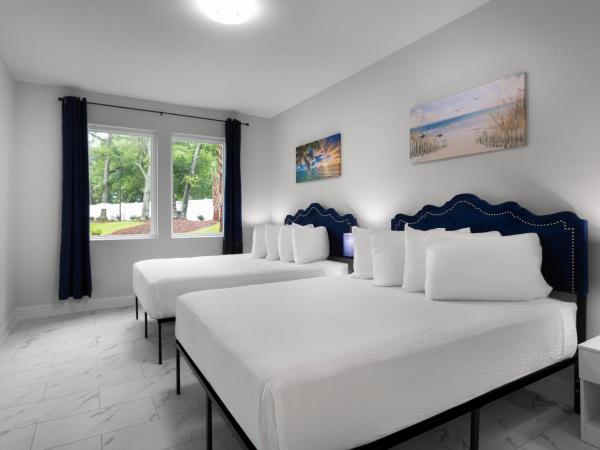 Ocean Escape Condos North : photo 9 de la chambre four-bedroom condo with balcony