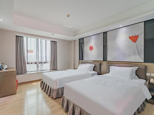 Insail Hotels (Pazhou Exhibition Center KeCun Metro Station Dunhe Road Branch Guangzhou) : photo 9 de la chambre chambre lits jumeaux deluxe
