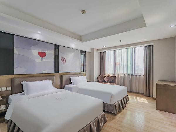 Insail Hotels (Pazhou Exhibition Center KeCun Metro Station Dunhe Road Branch Guangzhou) : photo 1 de la chambre chambre affaires lits jumeaux