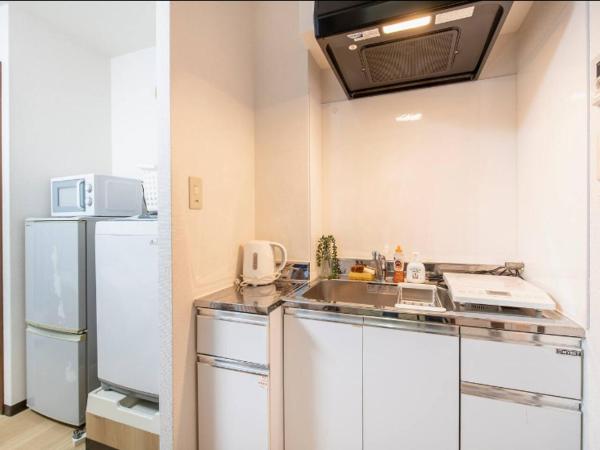 Uhome Tabata Apartment : photo 2 de la chambre chambre simple avec salle de bains 