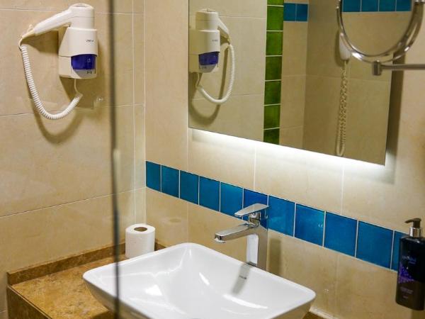 The Grand Mira Business Hotel : photo 1 de la chambre chambre deluxe double ou lits jumeaux