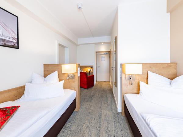 Maingau Hotel : photo 1 de la chambre chambre lits jumeaux