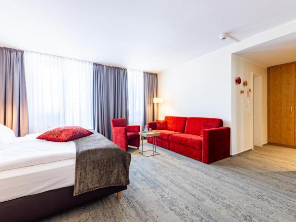 Maingau Hotel : photo 3 de la chambre chambre familiale avec baignoire