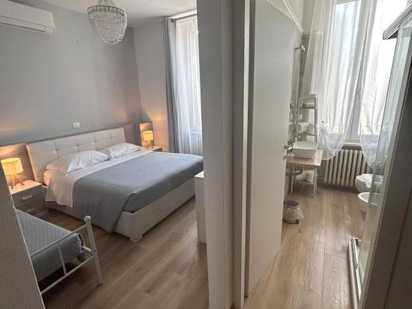 B&B Magnolia : photo 1 de la chambre chambre triple avec salle de bains privative